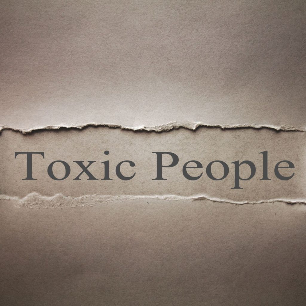 Toxic people written on a piece of old paper. 